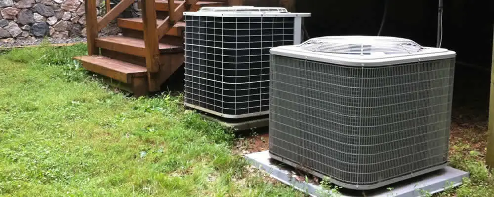Heat pump installation and service units outside a home in Boston, MA