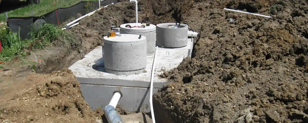 Septic system repair and installation site with tank access ports in Boston, MA